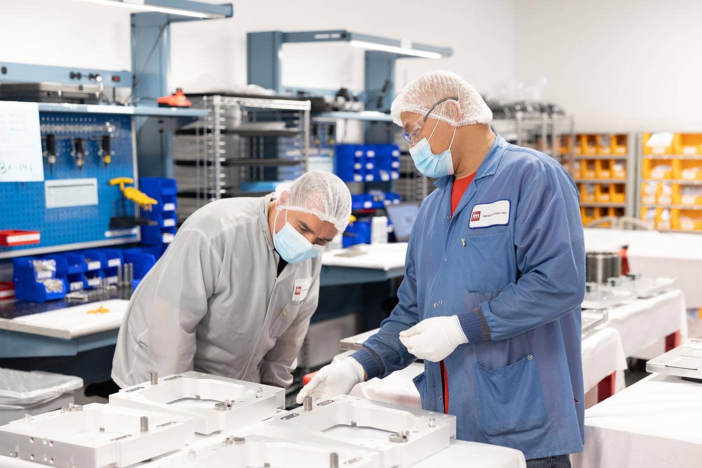 Cleanroom Employees Inspecting Components